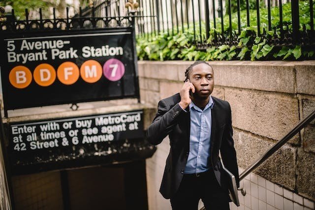 Man in a suit exiting the subway and talking about how real estate agents in NYC can benefit from storage