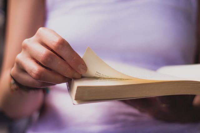 Person reading a book.