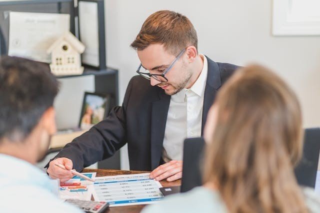 A real estate agent talking to his clients